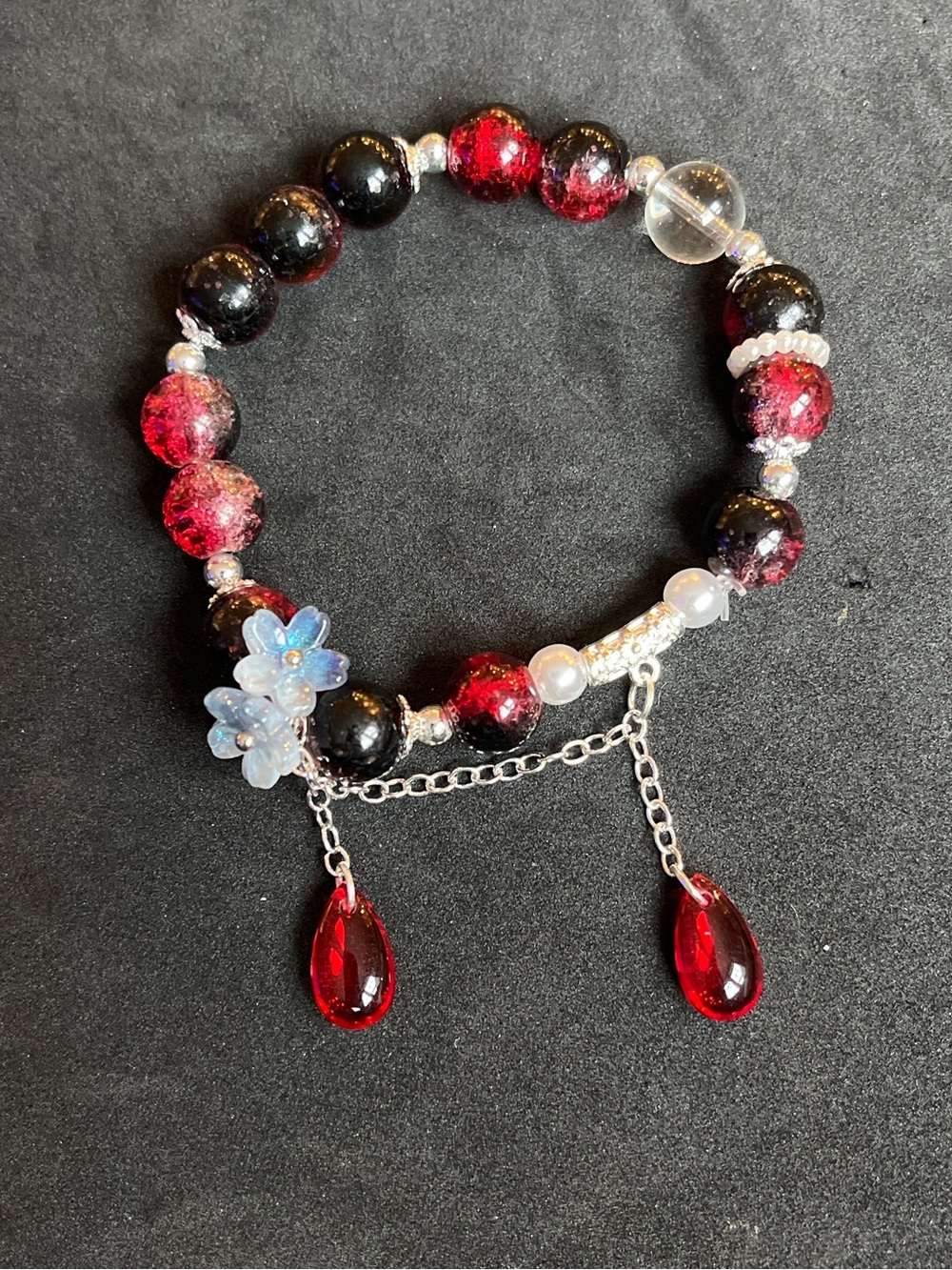 Handmade Red and Black Beaded Charm Bracelet with Floral Accent